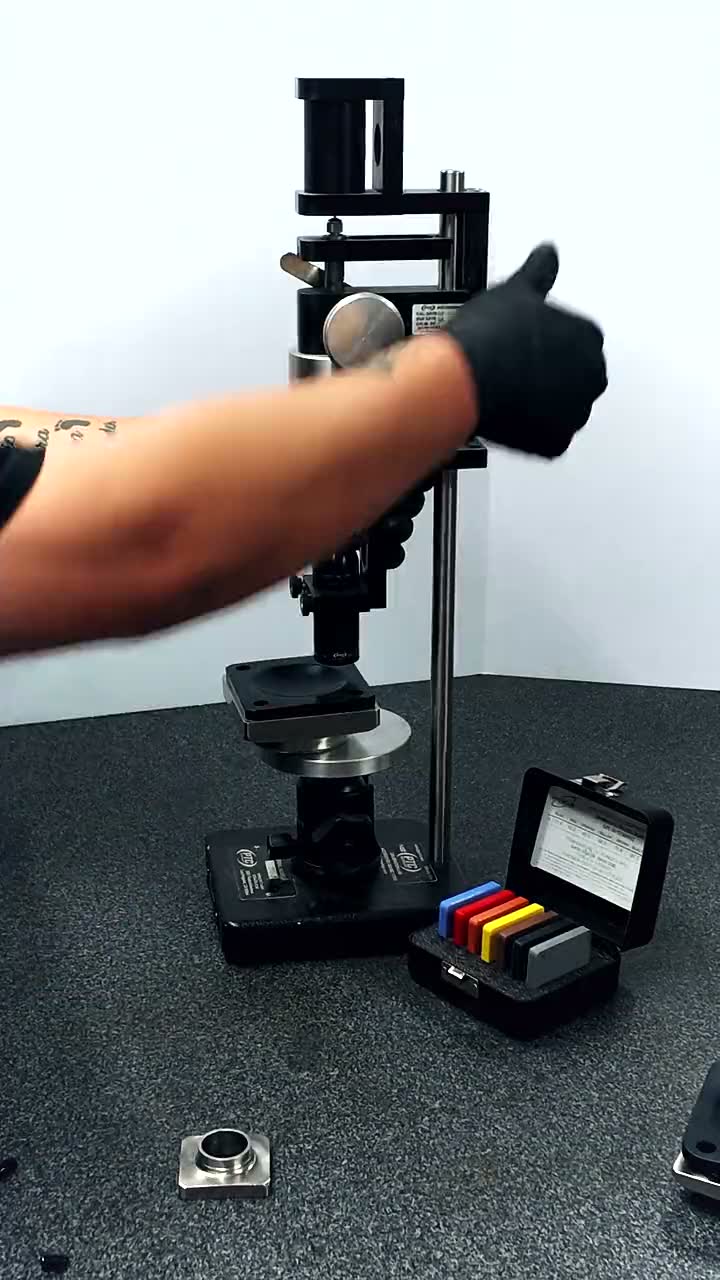 A PTFE diaphragm measured under a bench comparator on the granite surface plate