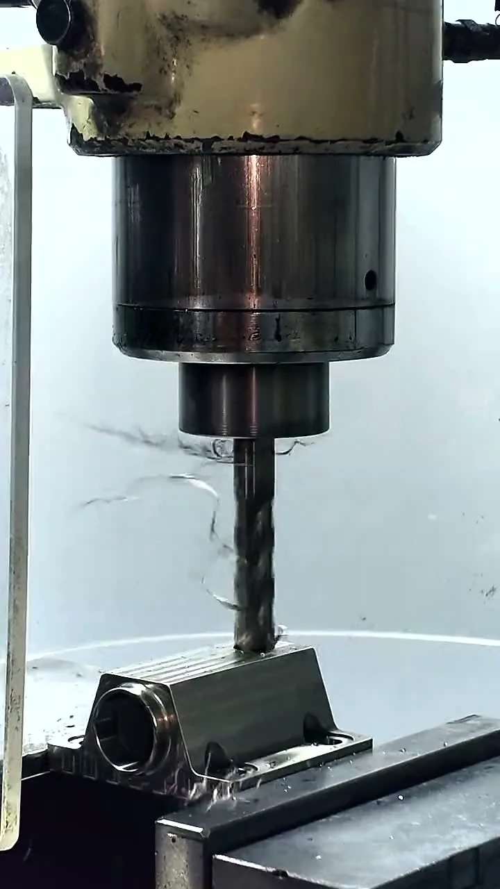 A drill running into a 316L stainless part under coolant on a machining center in Carson City
