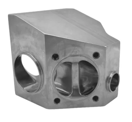 Machined block body showing interior weir and seal geometry